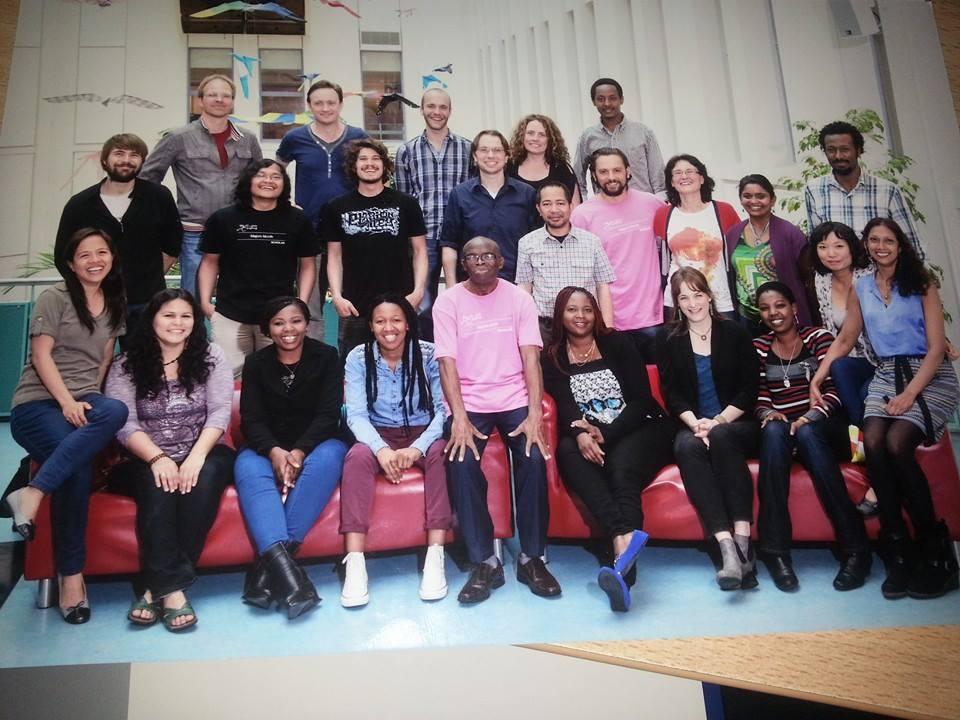 Class photo, where the Antidogmatist (Antonio) stands behind Mawu (seated, in stylish pink shirt).